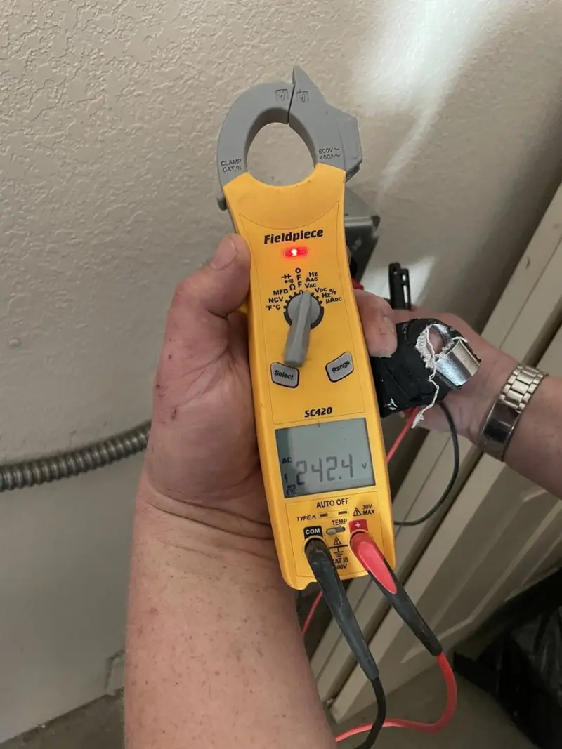 Voltage testing with clamp meter during Ceiling Fan Installation in Chesterfield